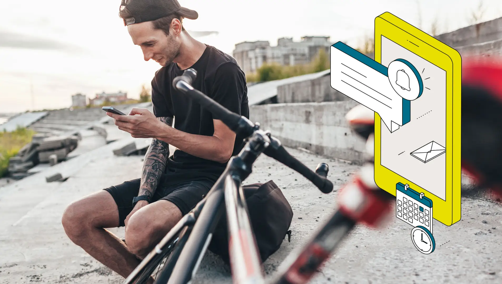 Ein Radfahrer schaut in einer Pause auf sein Smartphone.